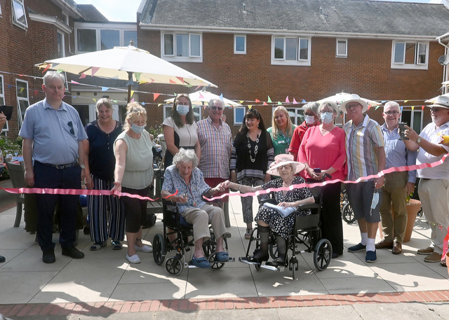 Residents Jean Dorothy cutting the ribbon